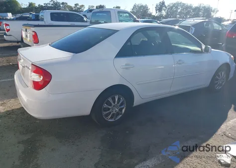 2003 Toyota Camry Le z USA, uszkodzony, nr VIN JTDBE32K730188966